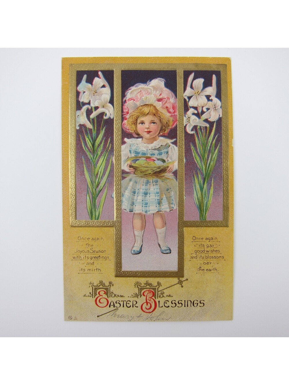 Easter Postcard Girl in Hat Easter Eggs Basket Lily Flower Gold Embossed Antique